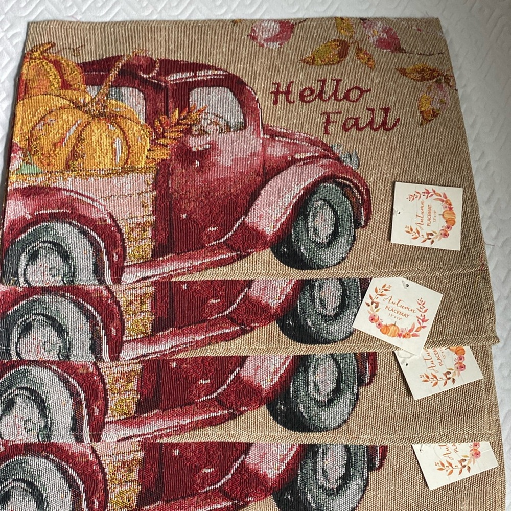 NWT set of 4 Autumn placemats. 13”x18”. Beautiful red truck pattern!